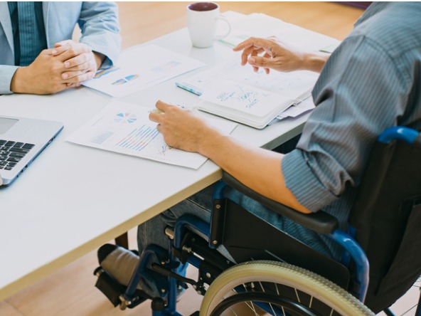 Wheelchair user at business meeting